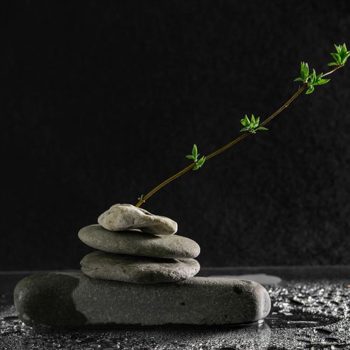 Balanced stones stack on a serene background, symbolizing inner peace.